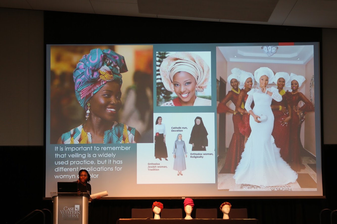 E presenting on hair wrapping at the NWSA Conference